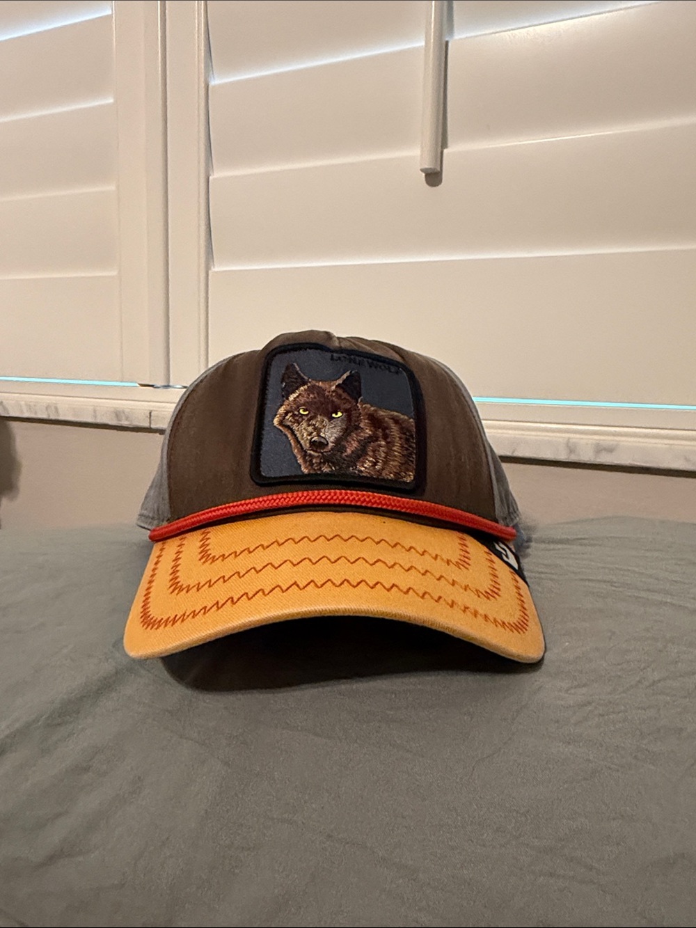 Lone Wolf Goorin Bros Brown Trucker Cap with Yellow Brim and Wolf Patch